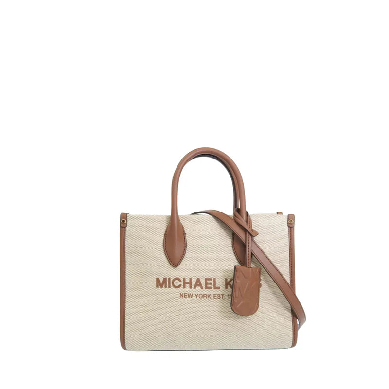 Michael Kors Mirella Small Shopper Crossbody bag made of canvas with leather trim.