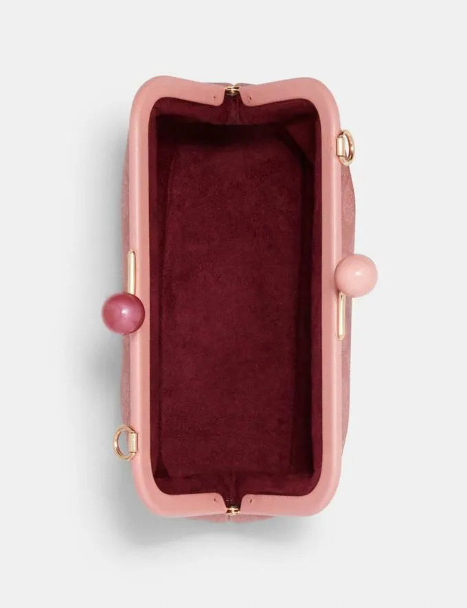 COACH Nora Kisslock Crossbody In Signature Canvas Candy Pink