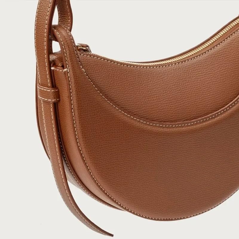 Polène Numéro Dix, a crescent-shaped leather bag