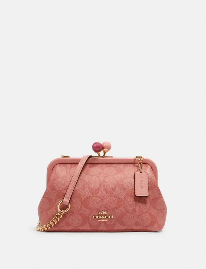 COACH Nora Kisslock Crossbody In Signature Canvas Candy Pink