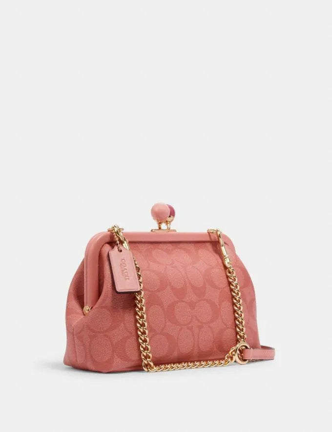 COACH Nora Kisslock Crossbody In Signature Canvas Candy Pink