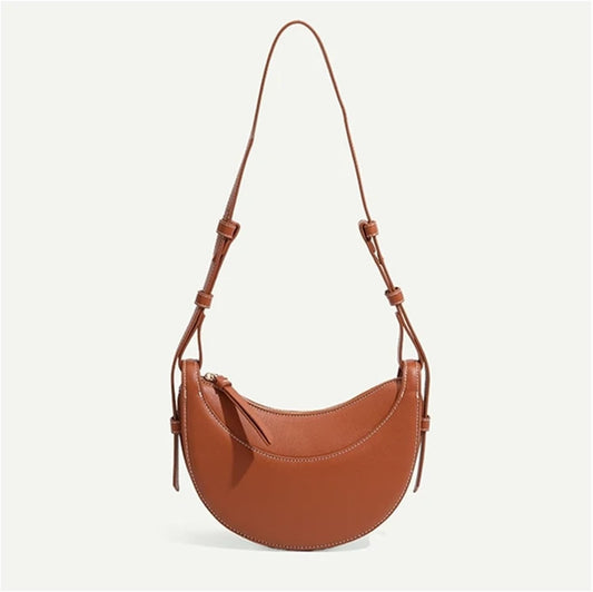 Polène Numéro Dix, a crescent-shaped leather bag