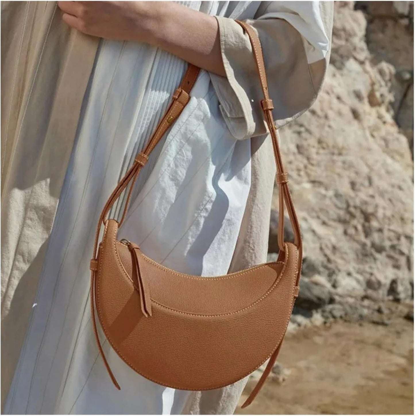Polène Numéro Dix, a crescent-shaped leather bag